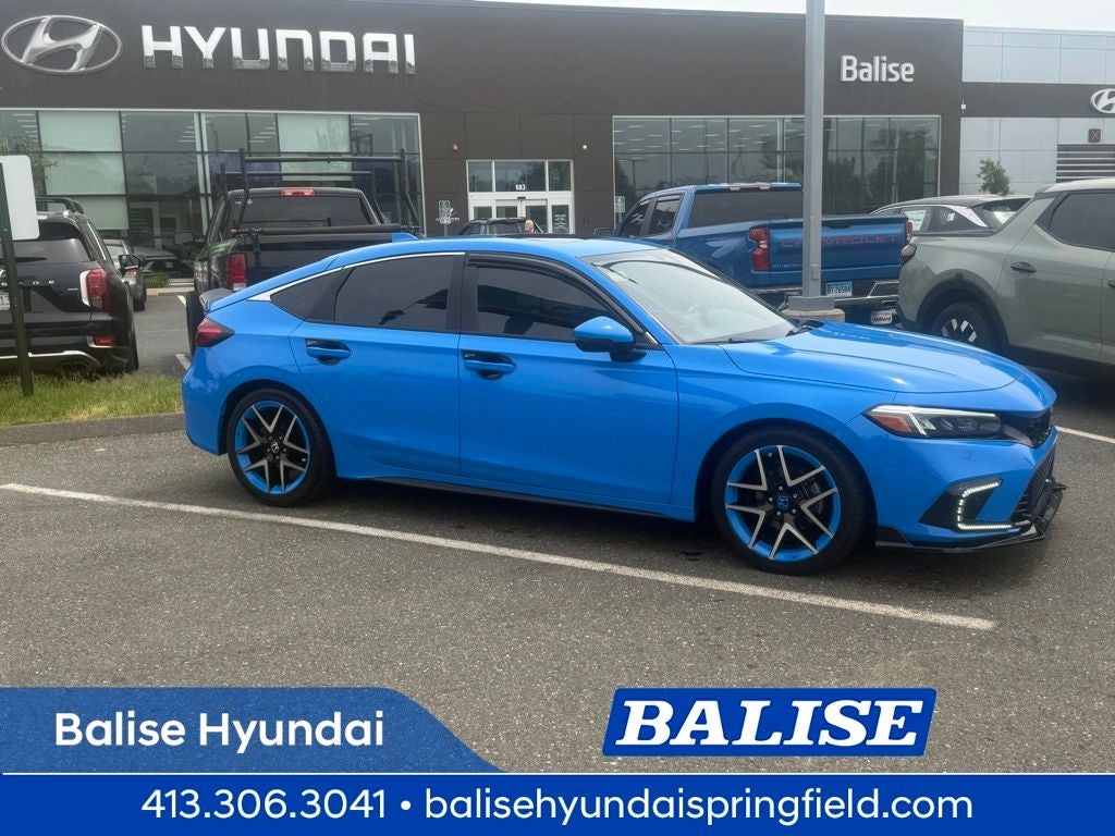 2022 Honda Civic Sport Touring in Blue — front three-quarter view