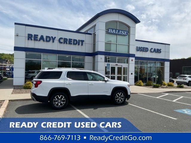 2023 GMC Acadia SLT in Summit White — front three-quarter view