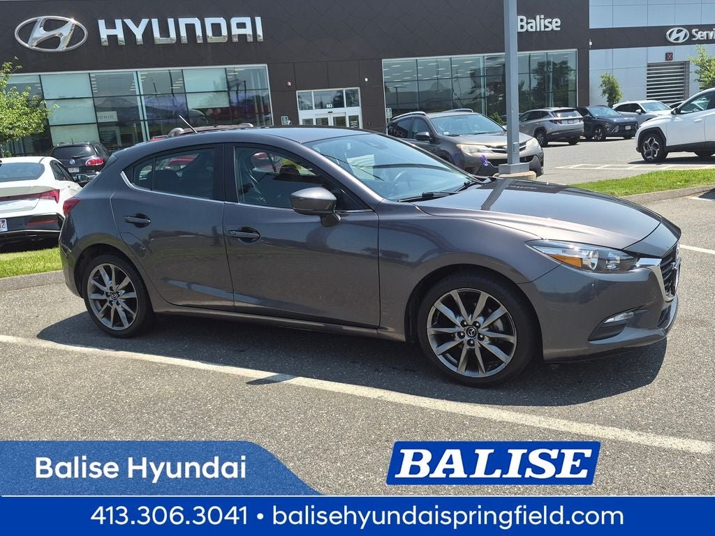 2018 Mazda Mazda3 Touring in Machine Gray Metallic — front three-quarter view