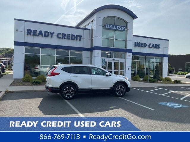 2018 Honda CR-V Touring in White Diamond Pearl — front three-quarter view