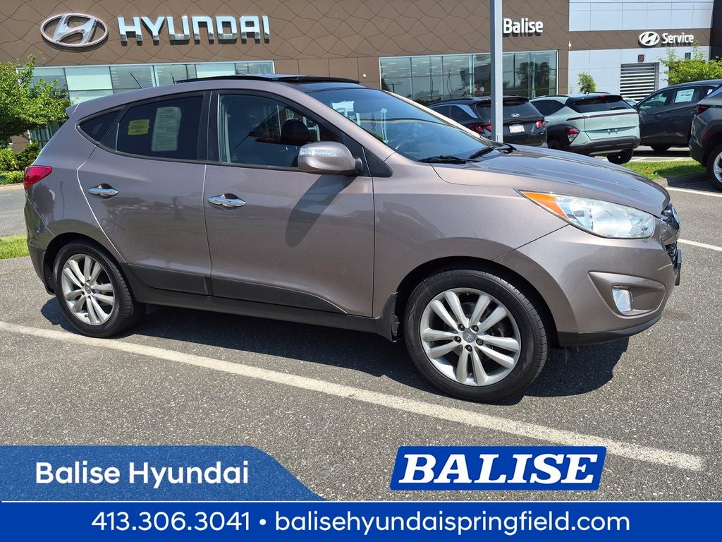 2013 Hyundai Tucson Limited in Chai Bronze — front three-quarter view
